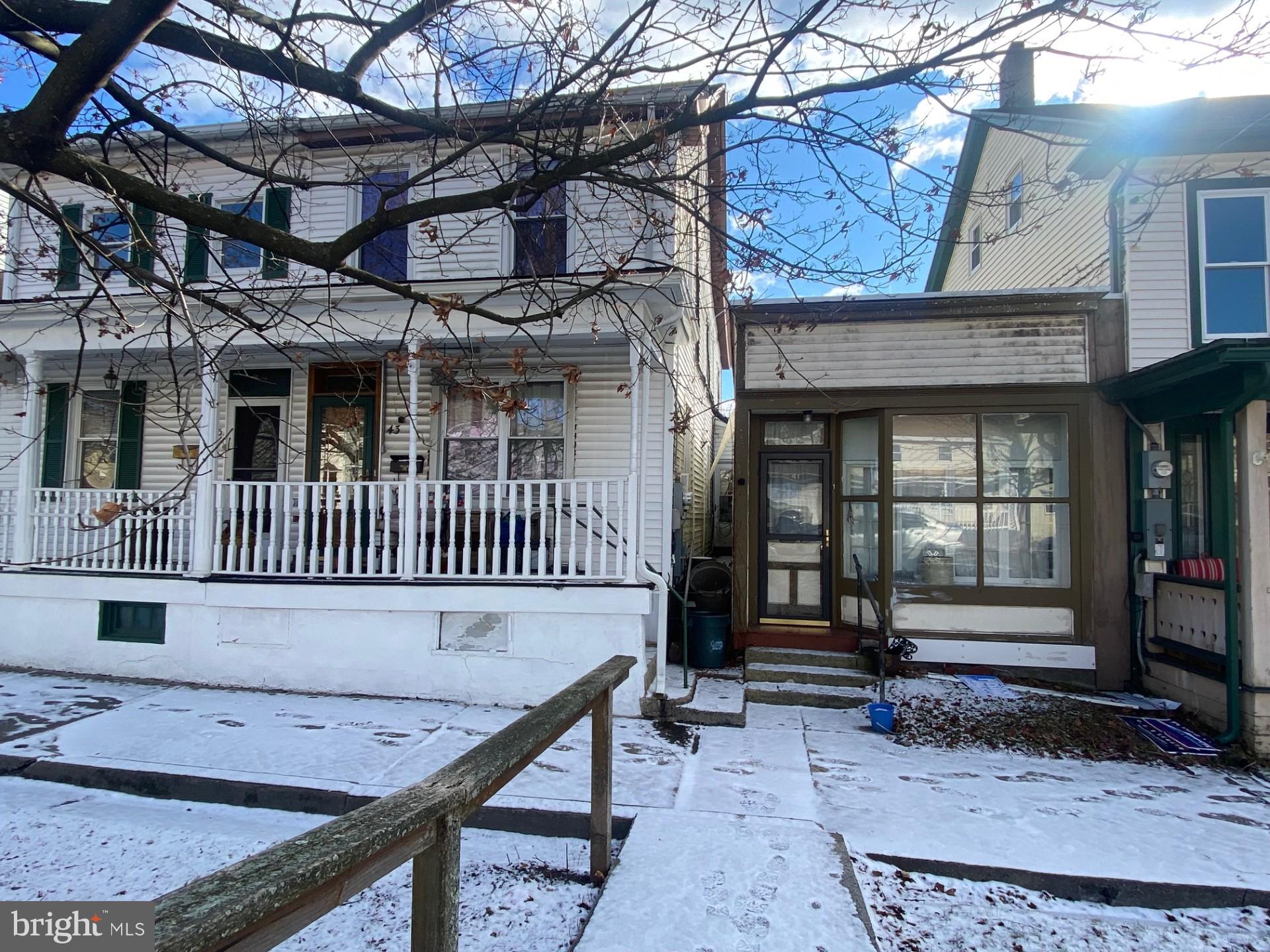 a view of a house with a wooden deck