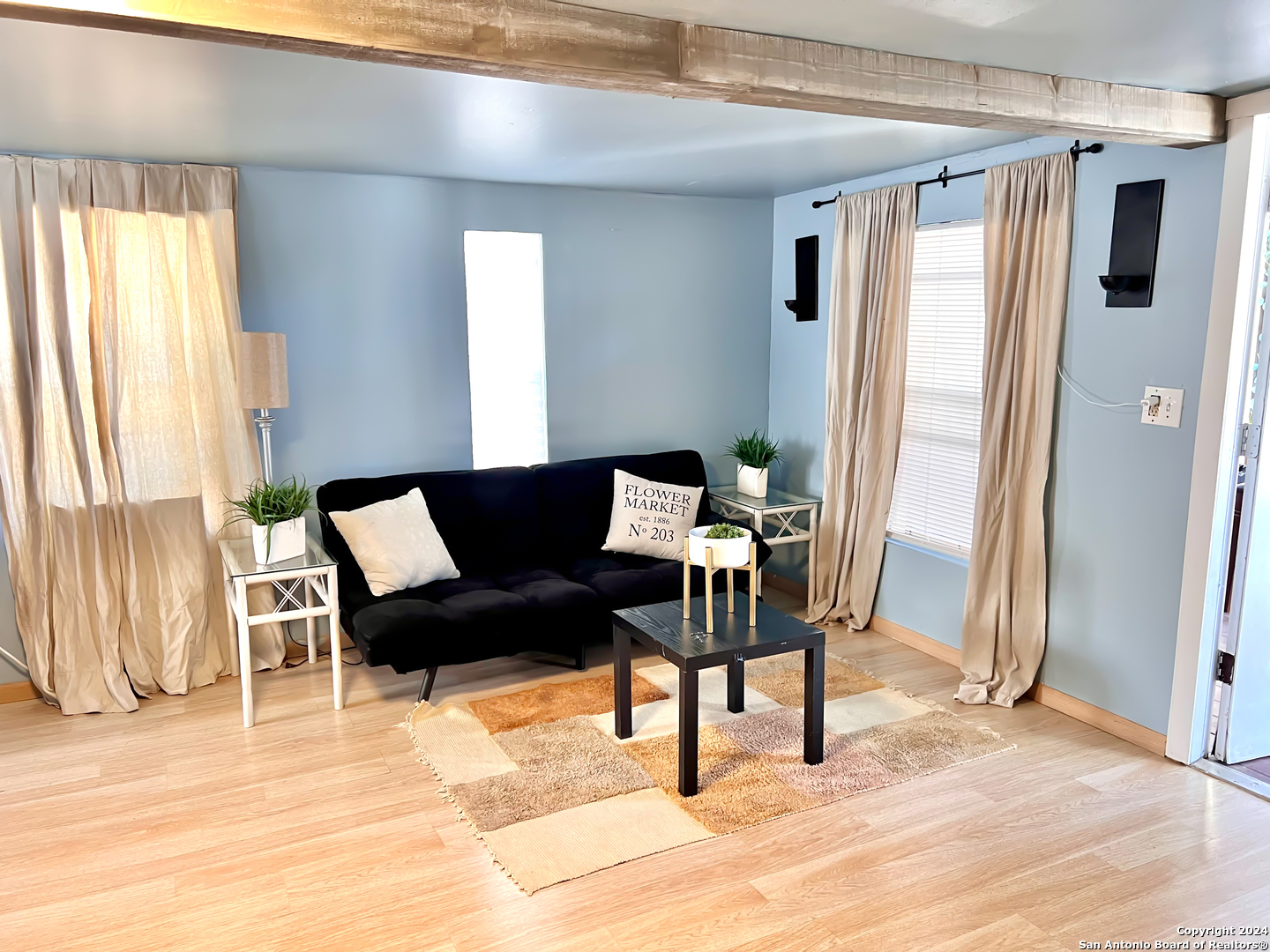 a living room with furniture and a rug