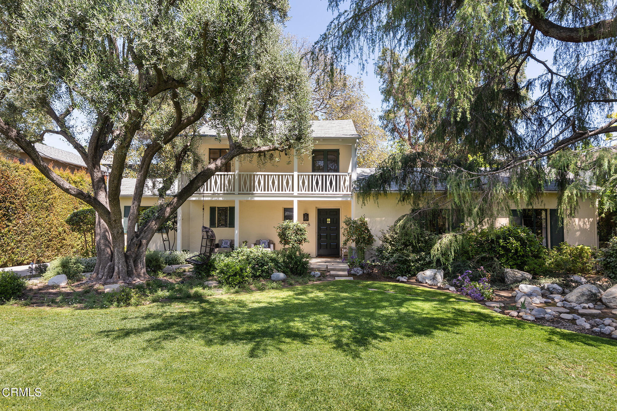 a front view of a house with garden