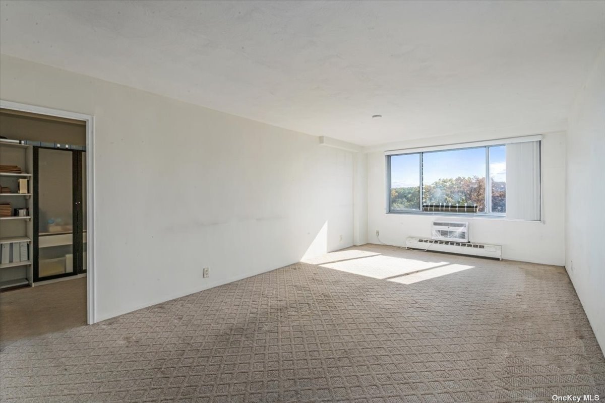 a view of an empty room with a window