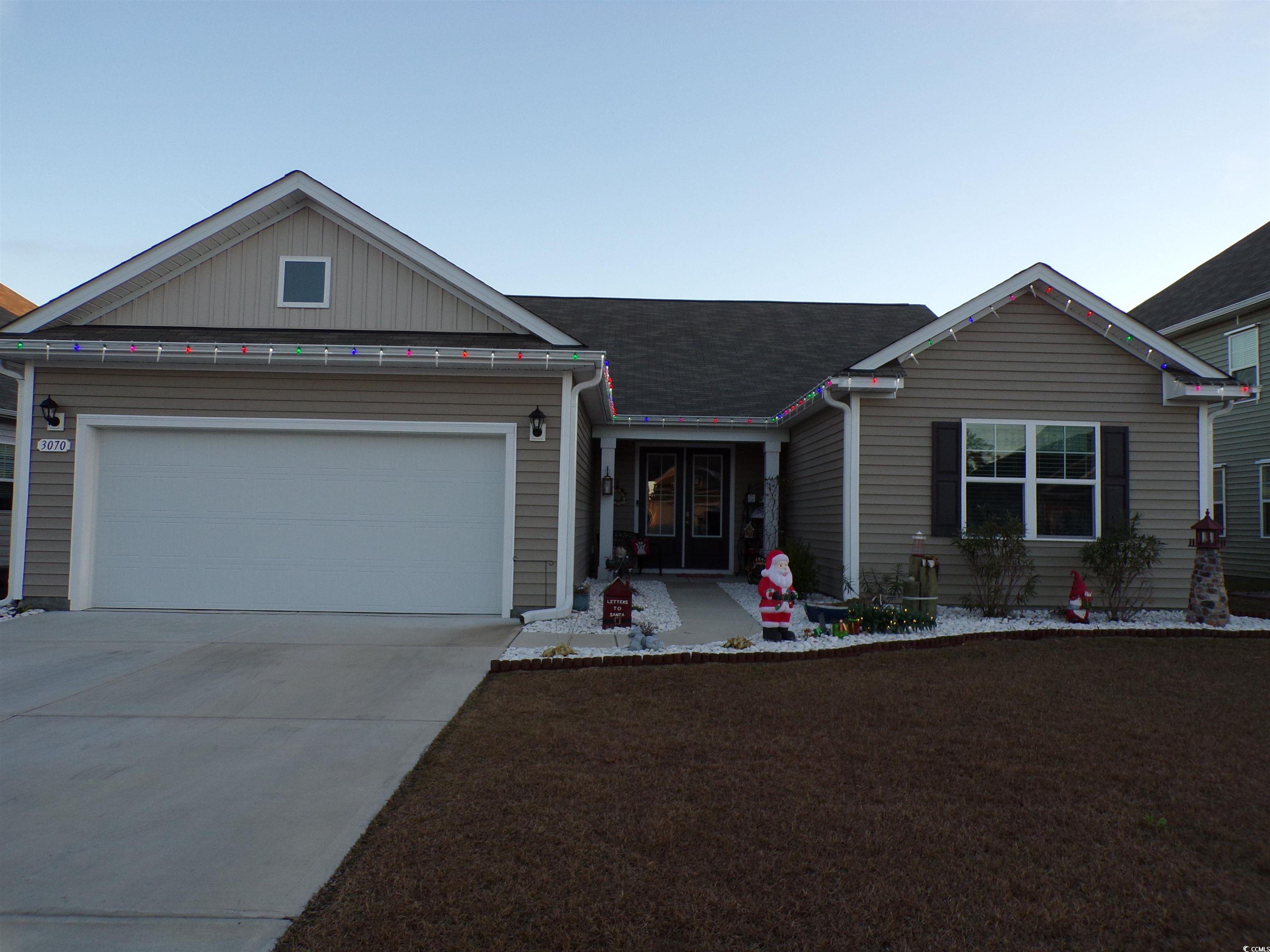 Single story home featuring a garage