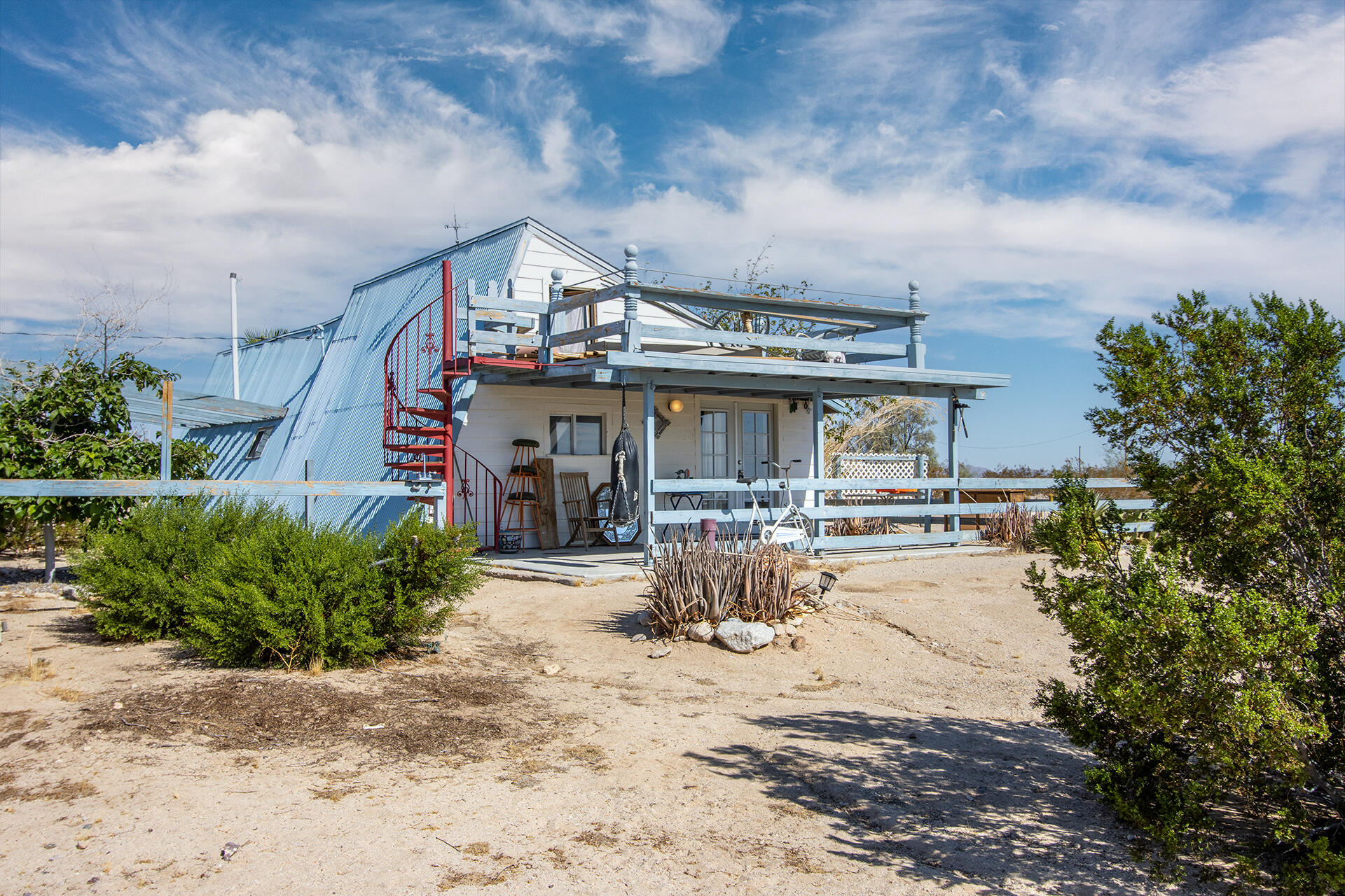 a front view of house with yard outdoor seating and barbeque oven