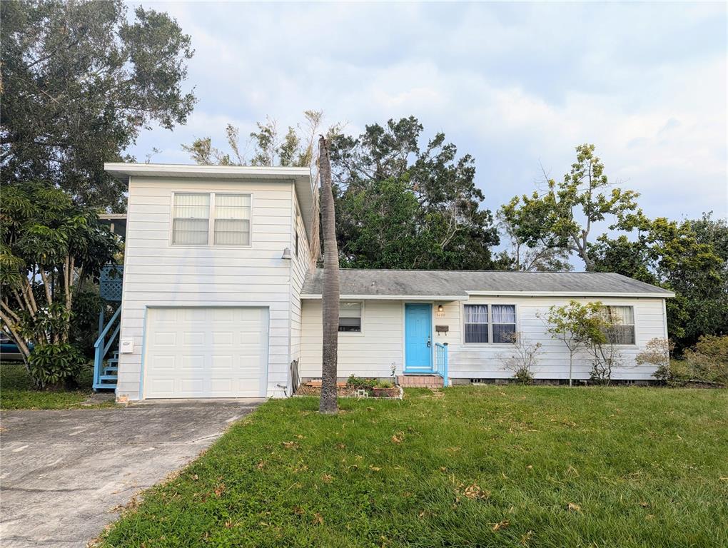 front view of a house with a big yard