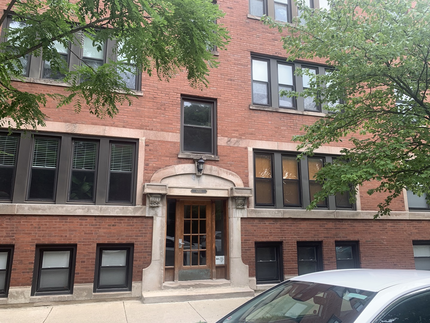 a view of a brick building with many windows