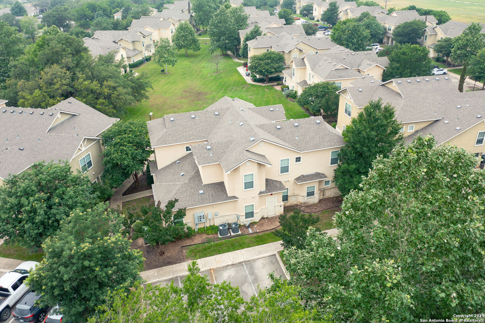 an aerial view of a house with yard swimming pool and outdoor seating