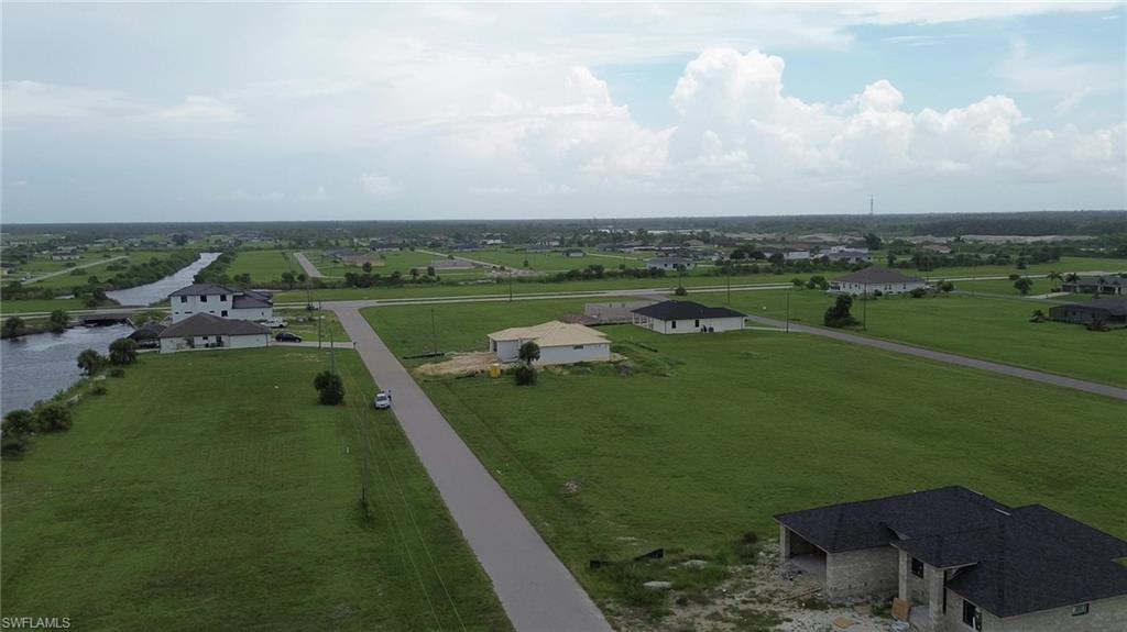 an aerial view of a golf course with huge green field and covered with green space