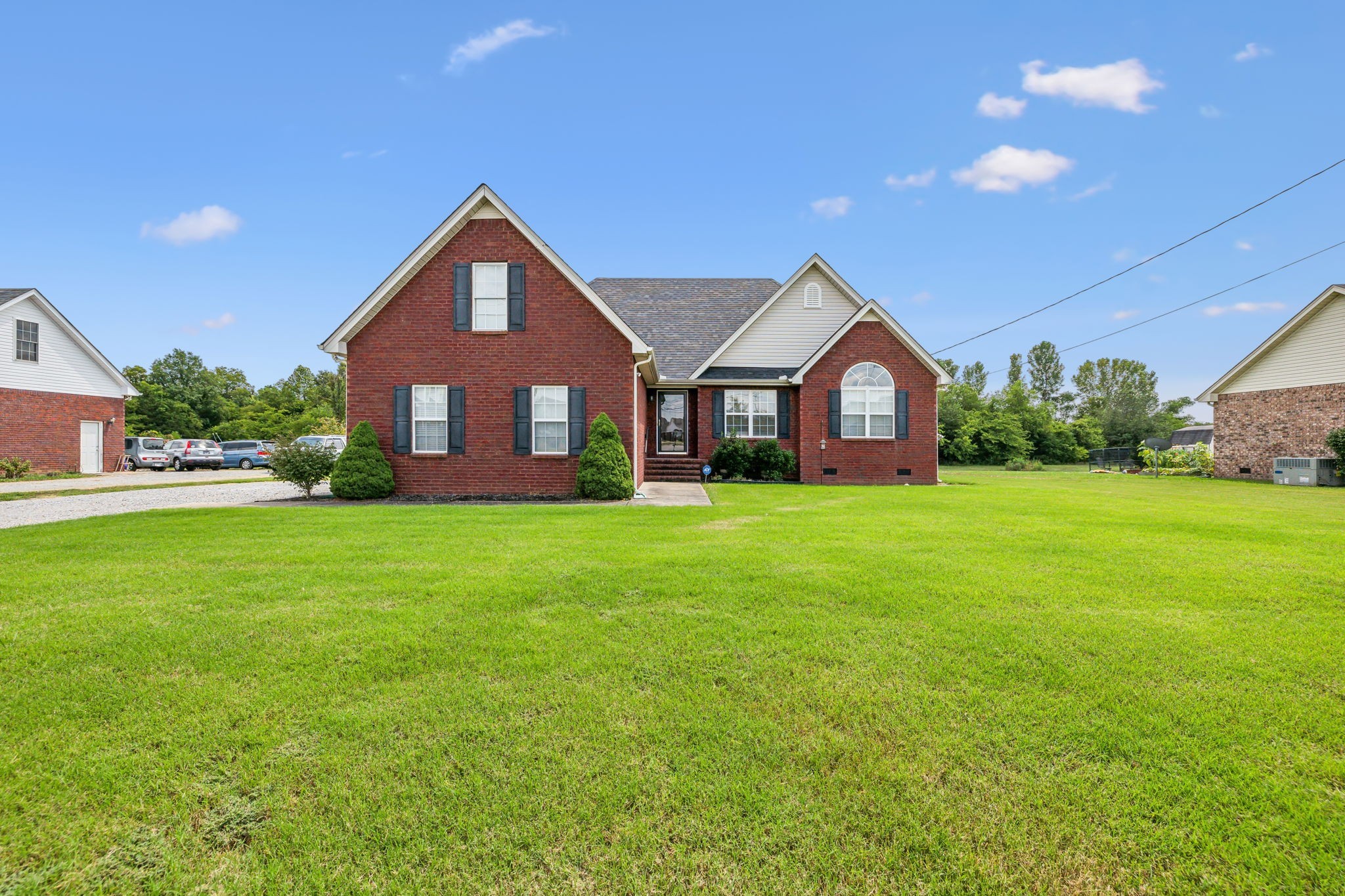 a front view of a house with garden