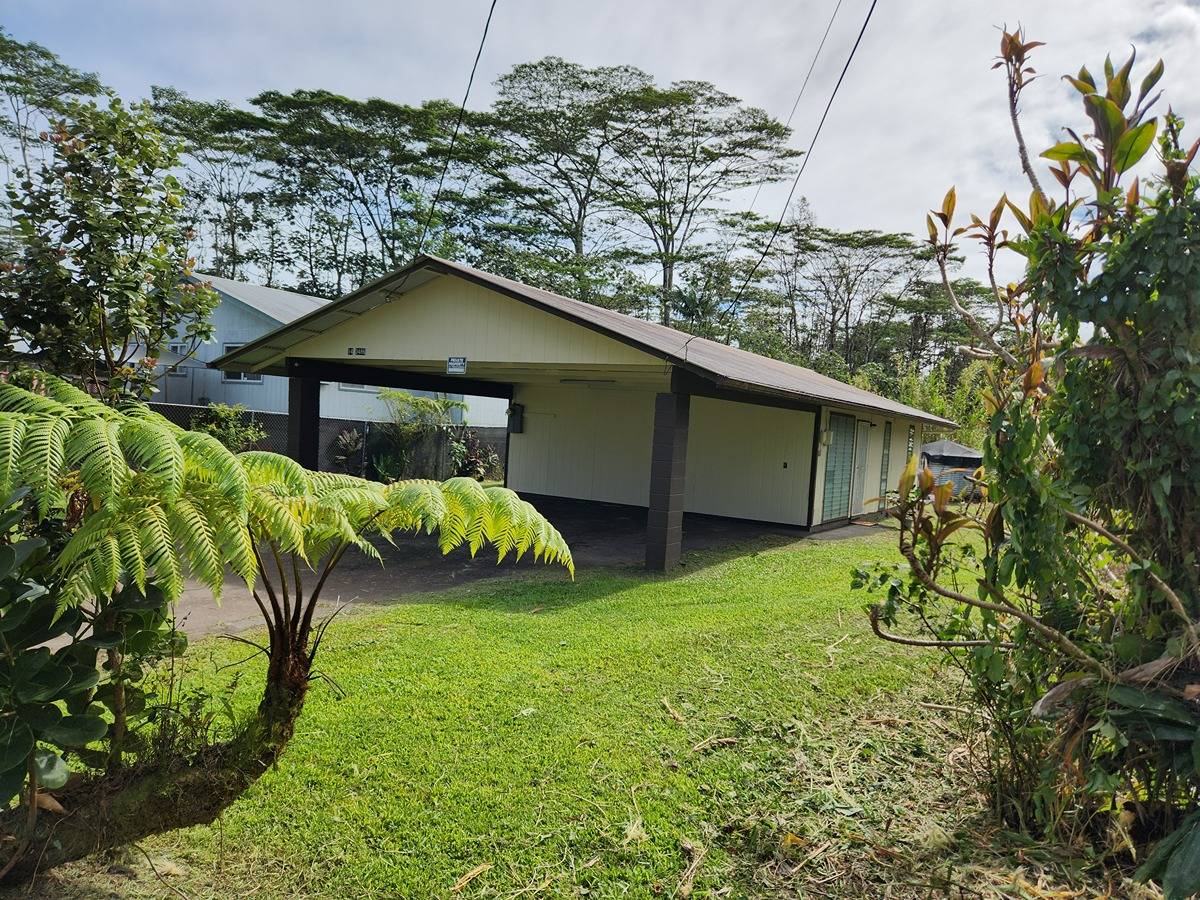 a backyard of a house with lots of green space