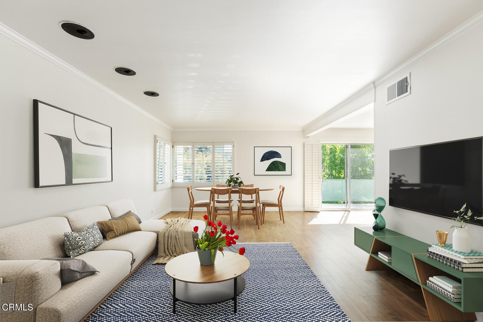 a living room with furniture and a flat screen tv