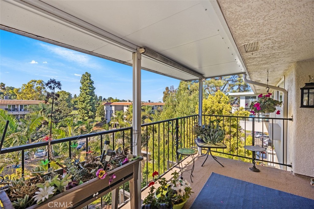 a view of a balcony with wooden floor