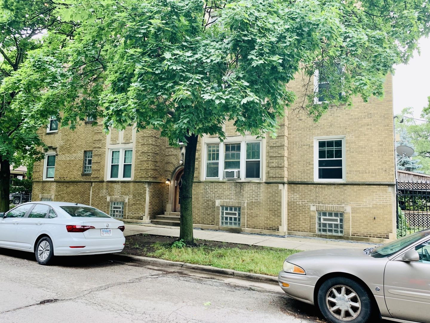 a front view of a house with parking space