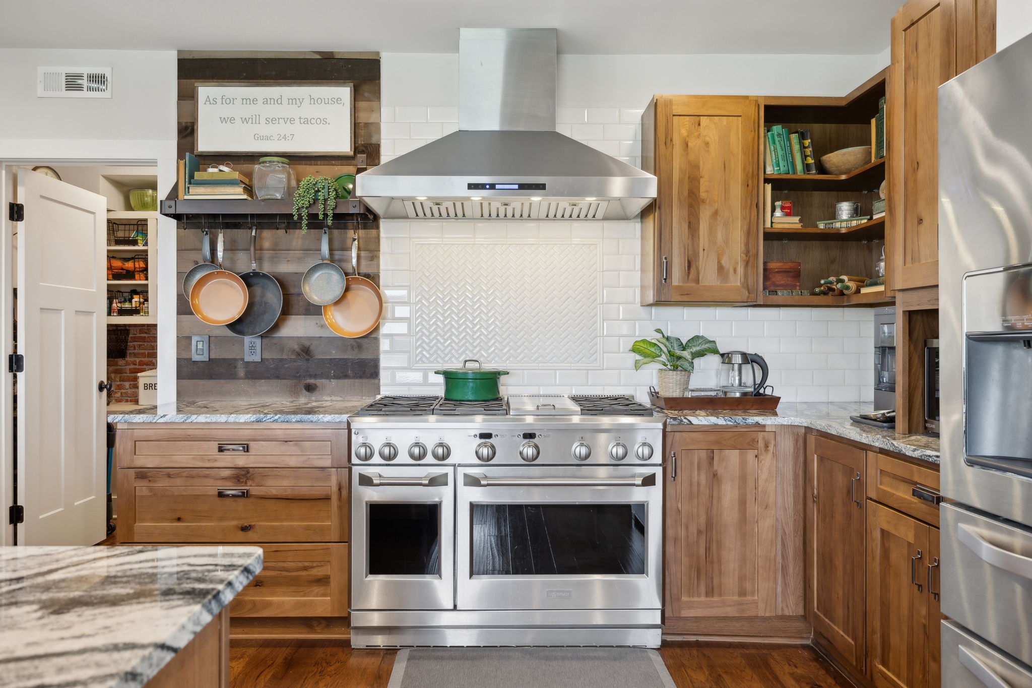 a kitchen with stainless steel appliances granite countertop a stove and a cabinets