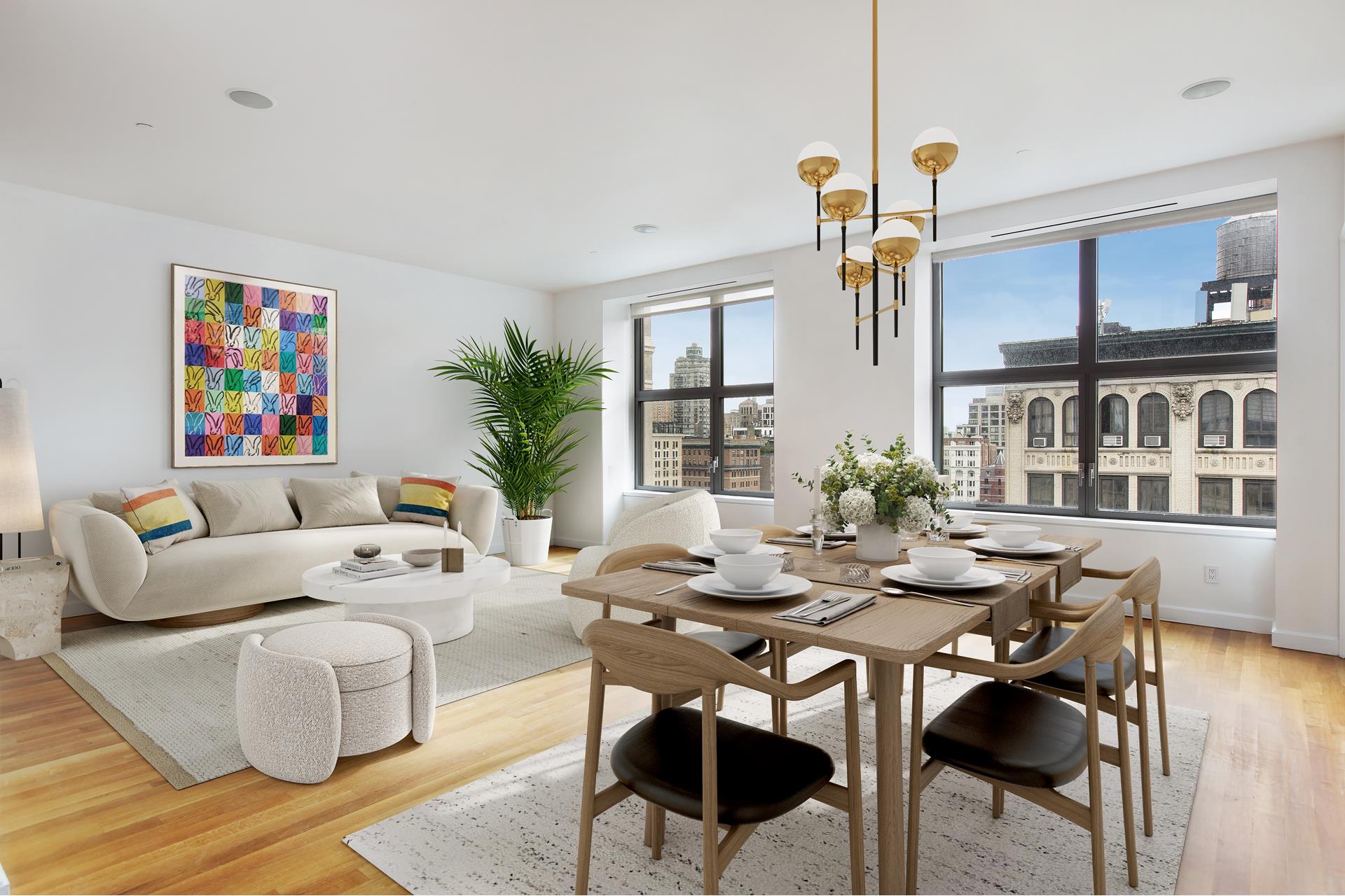 a living room with furniture a chandelier and a table