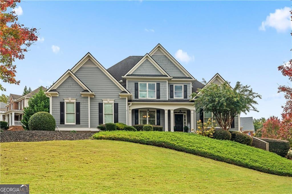 a front view of a house with a yard