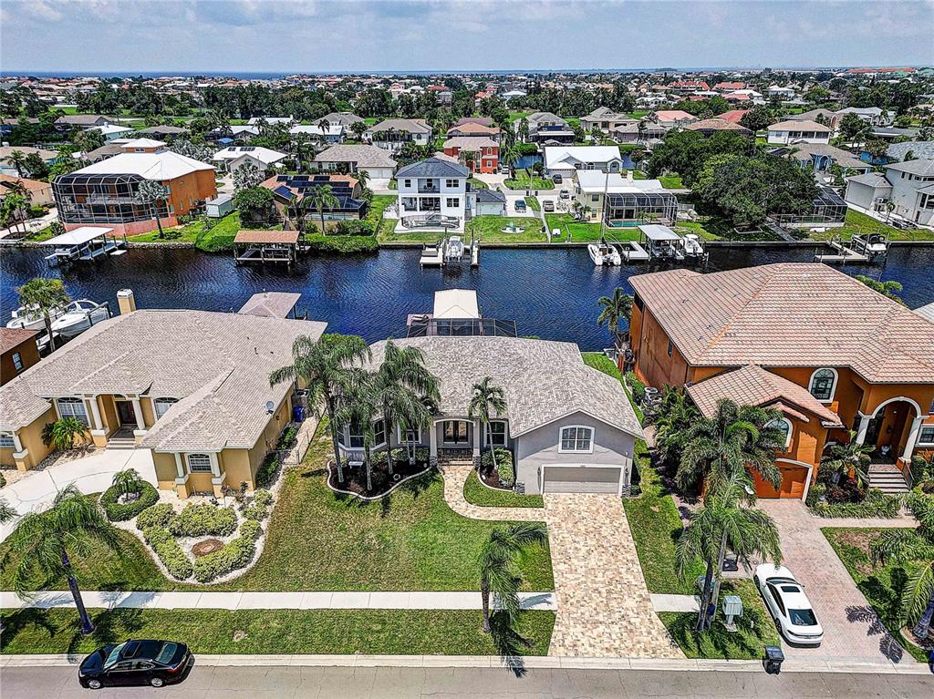 an aerial view of multiple houses with yard