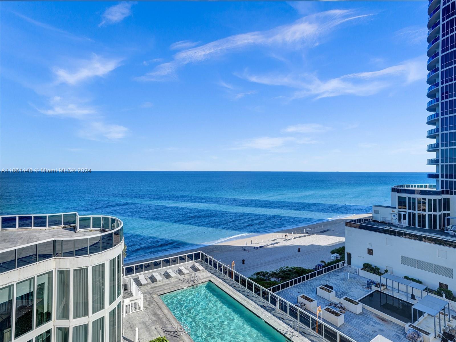 a view of a balcony with an ocean