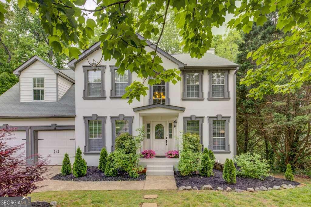 front view of a house with a yard