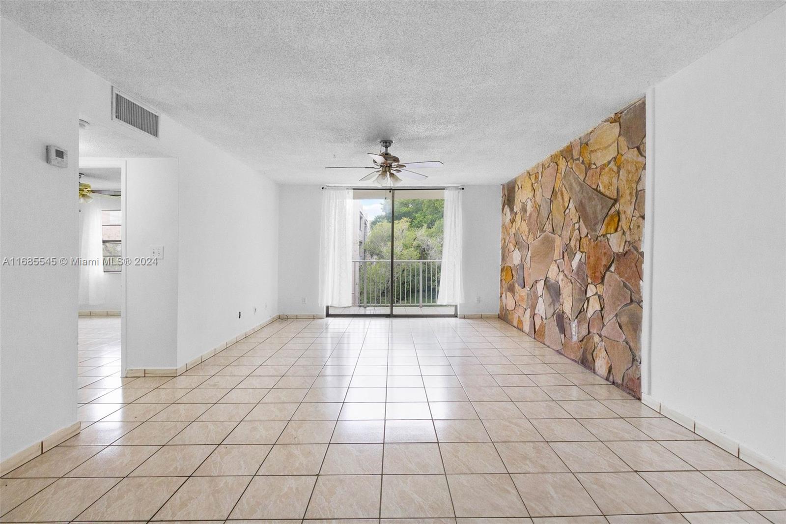 a view of an empty room and window