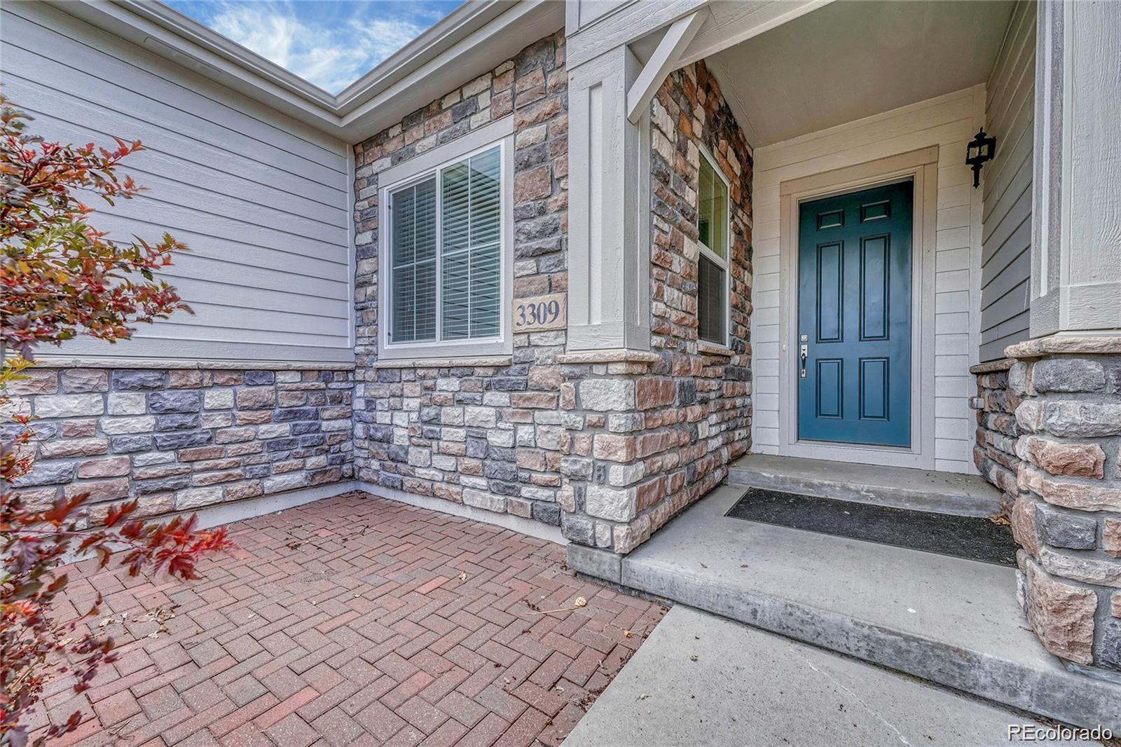 a view of front door of house with stairs