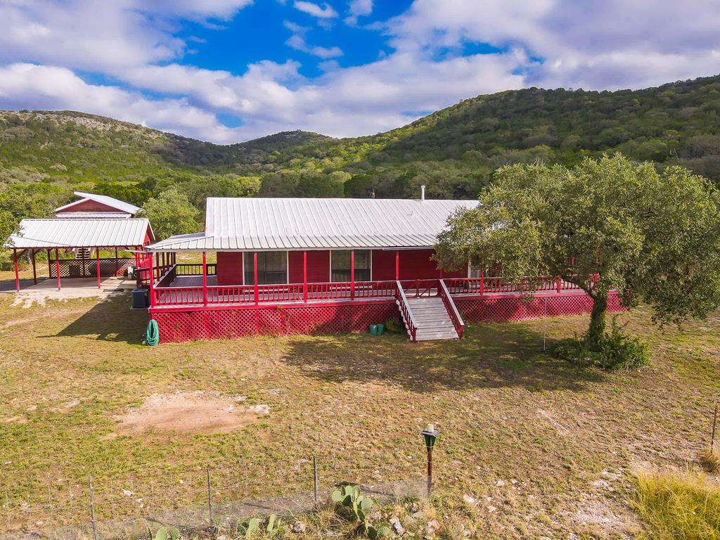 a view of houses with swimming pool and mountains