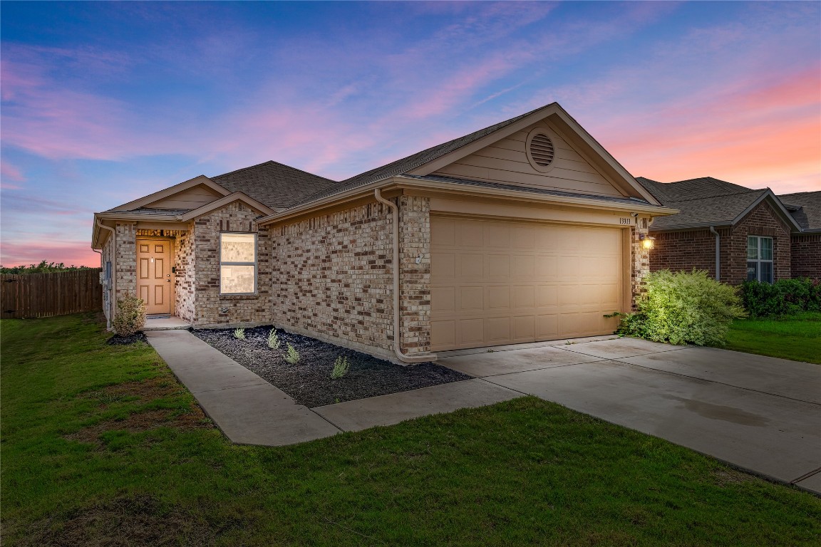 a front view of a house with yard