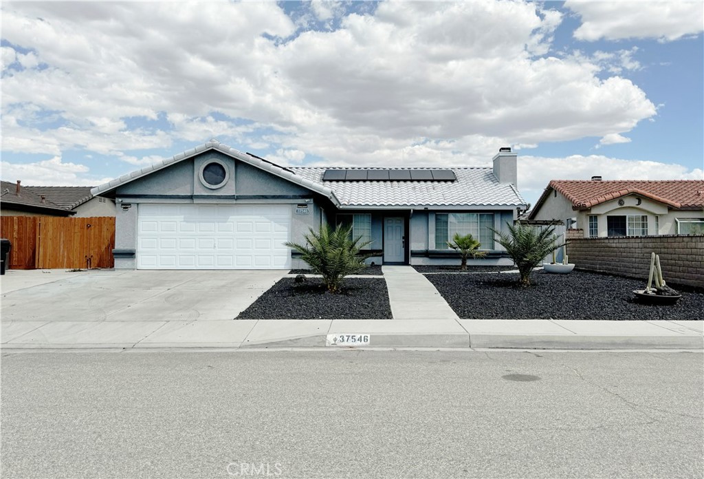 a front view of a house with garage