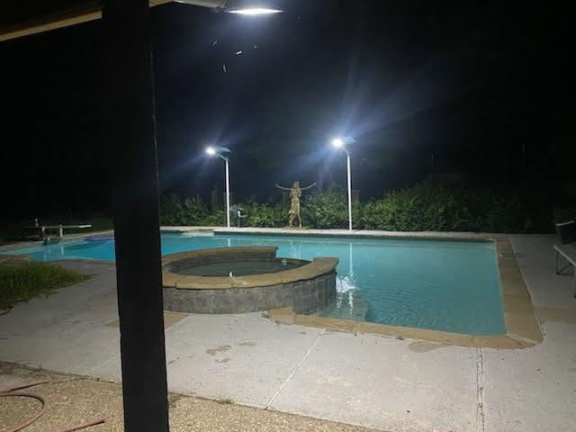 a view of a fountain in front of a house