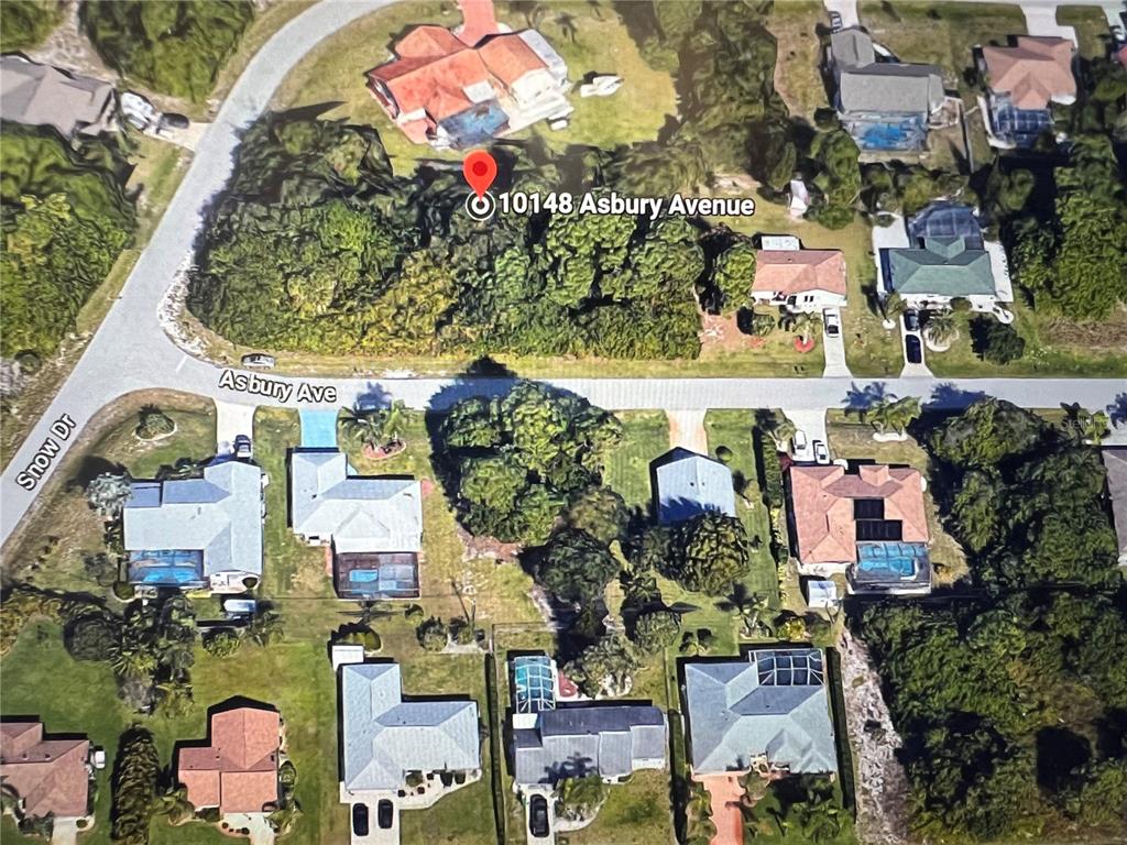 an aerial view of multiple houses with yard