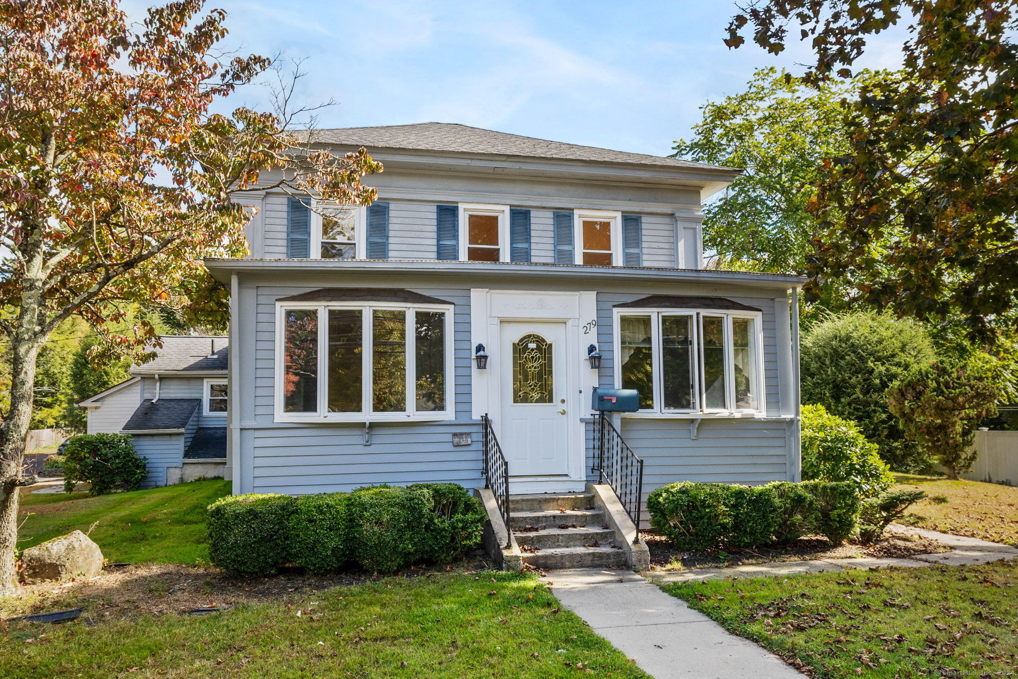 front view of a house with a yard