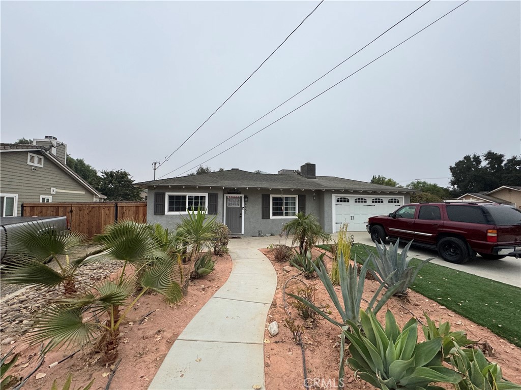 a house view with a garden space