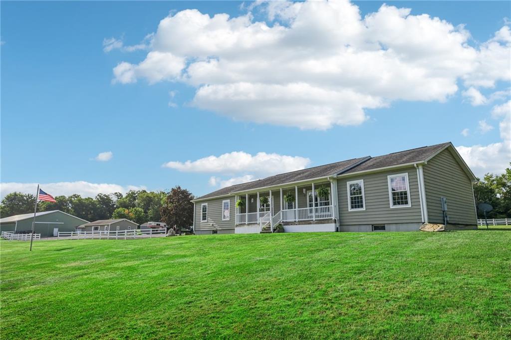 a view of a house with a backyard