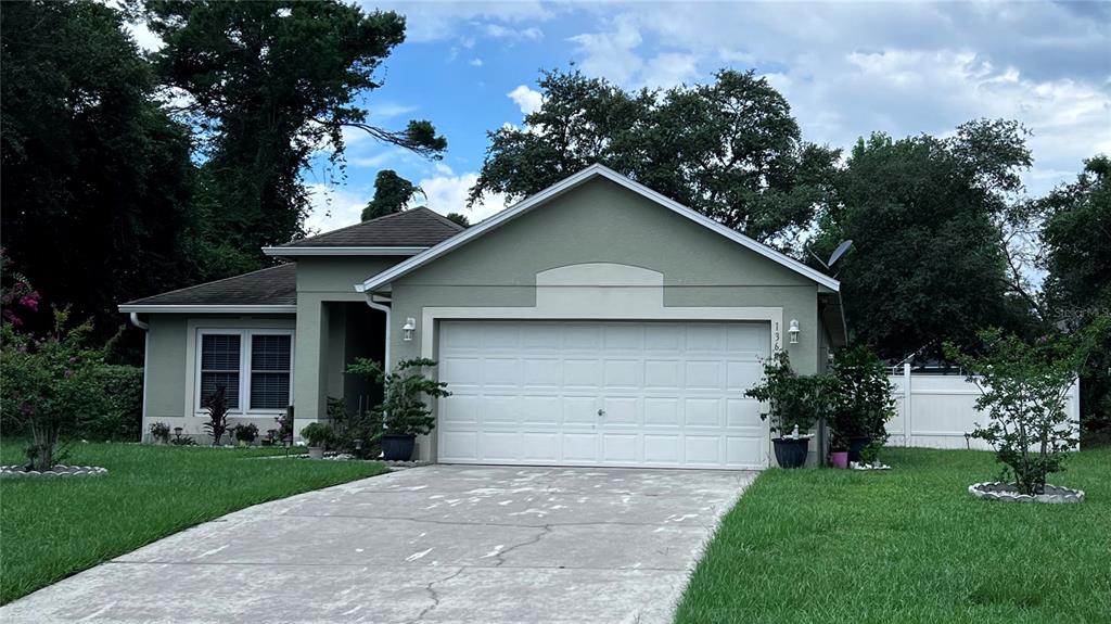 a front view of house with a yard