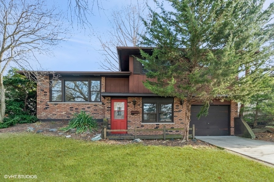 front view of a house with a yard