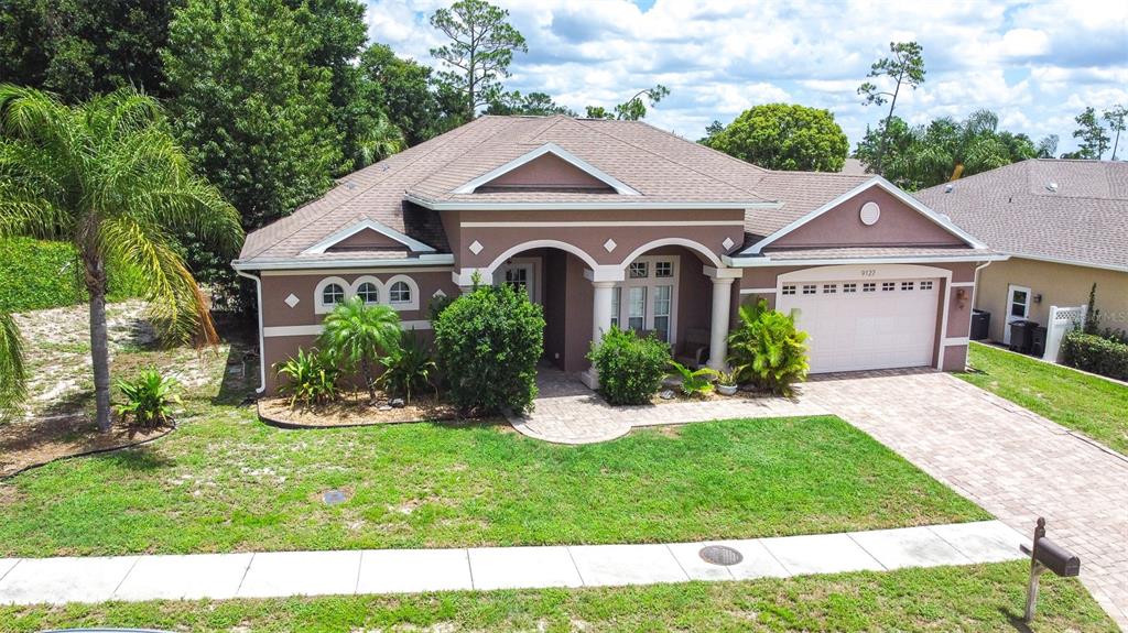 a front view of a house with a yard