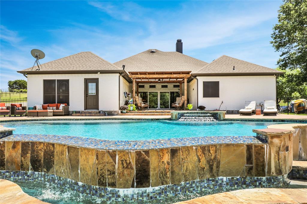 a front view of a house with swimming pool