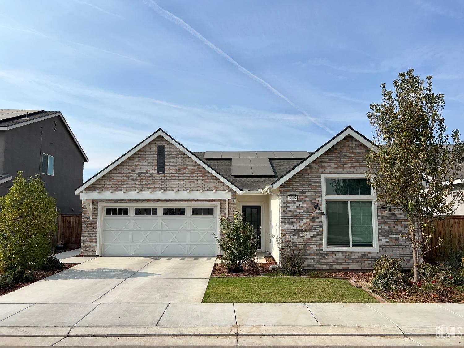 a front view of a house with garage