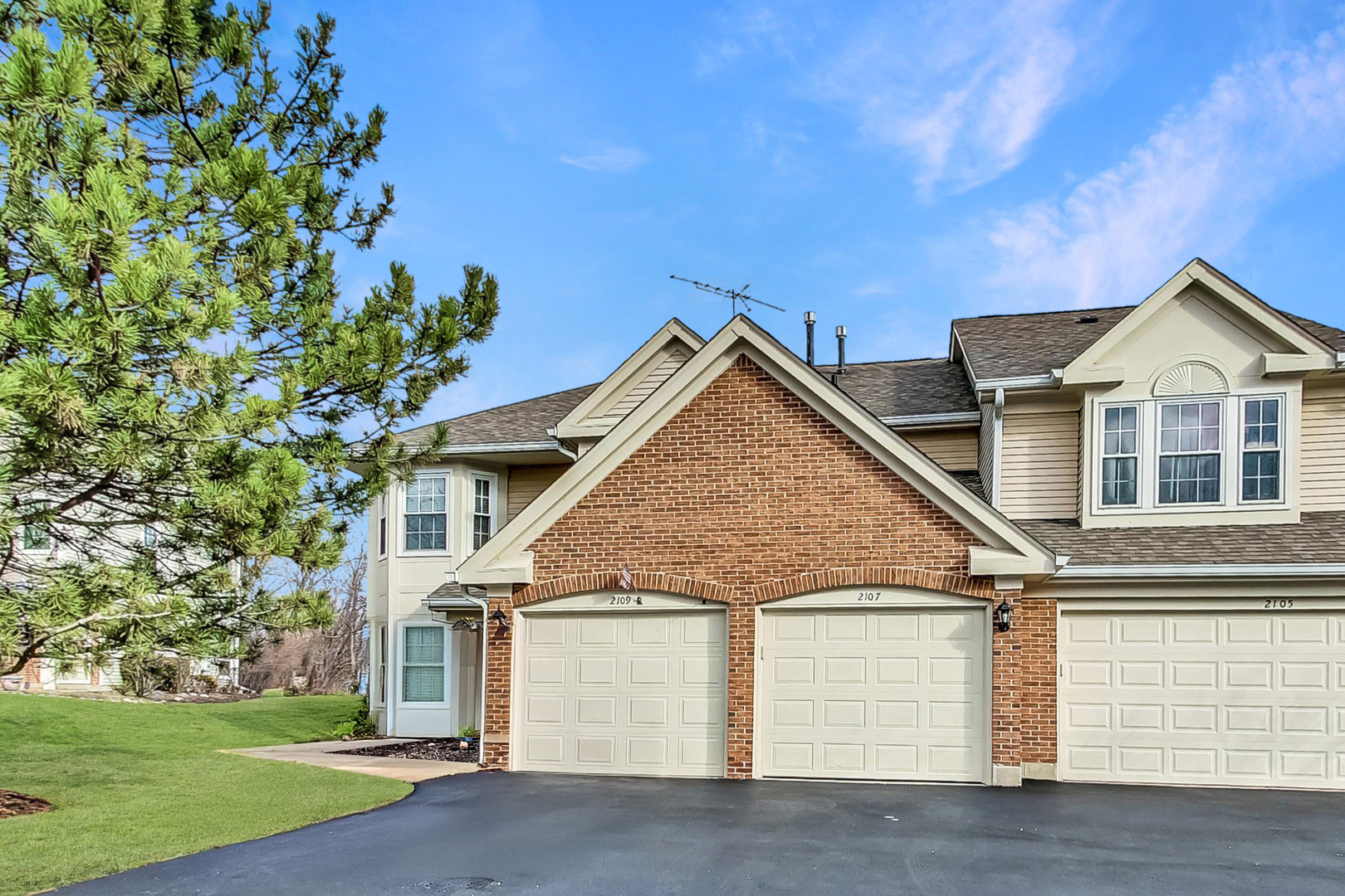 front view of a house with a yard