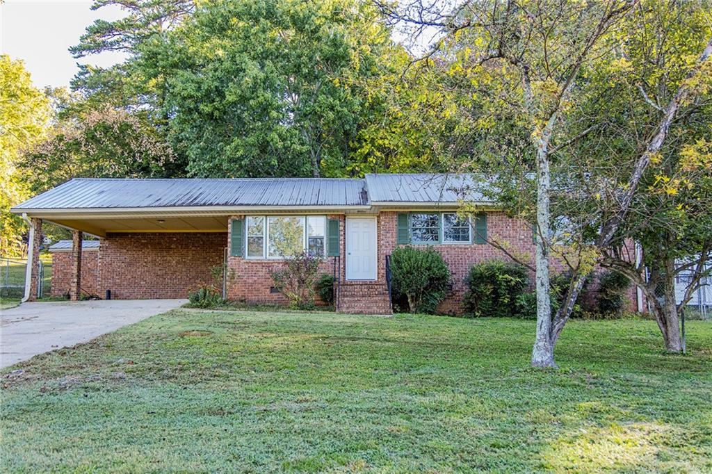 front view of a house with a yard