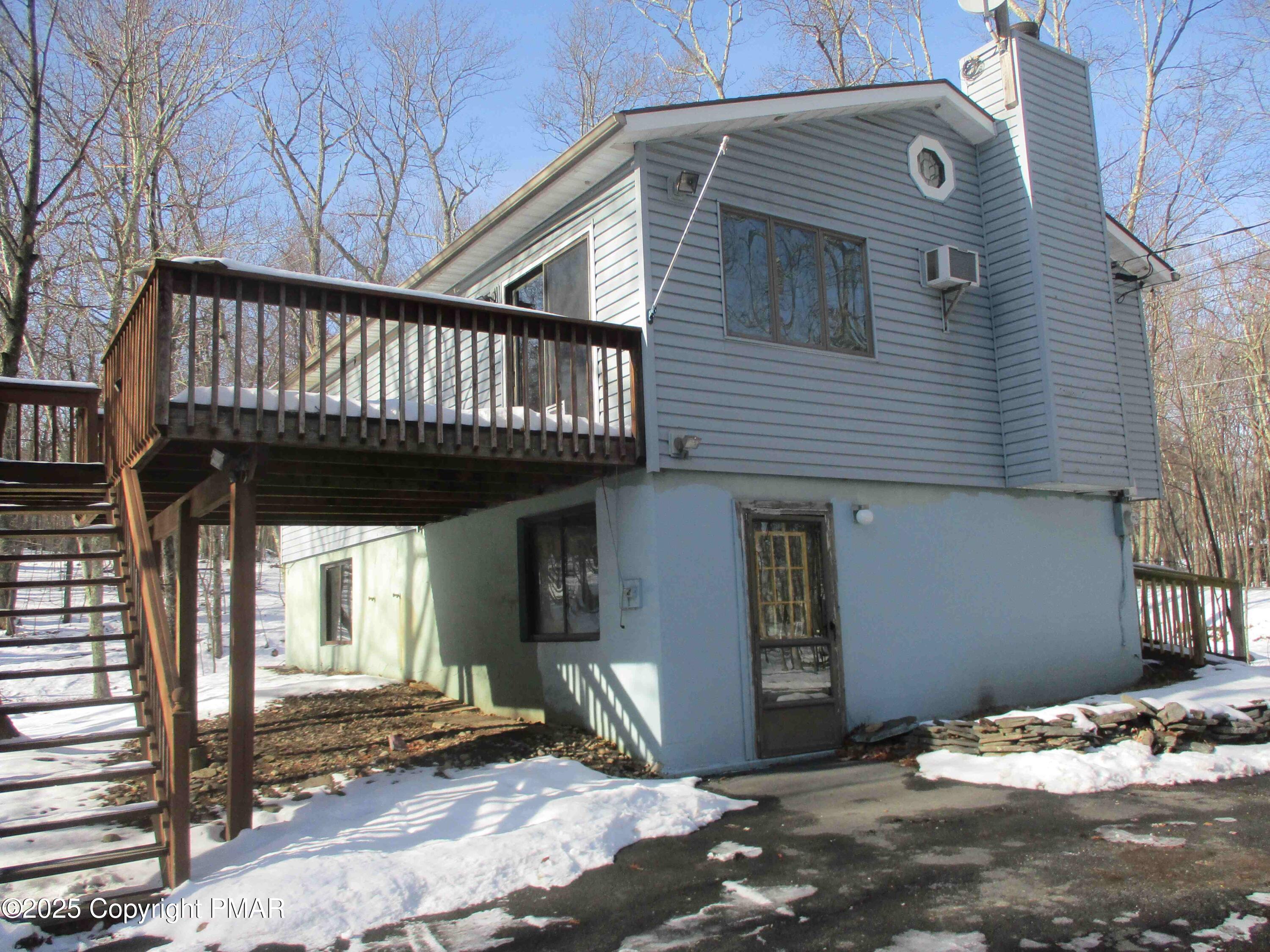 a view of a house with a roof deck