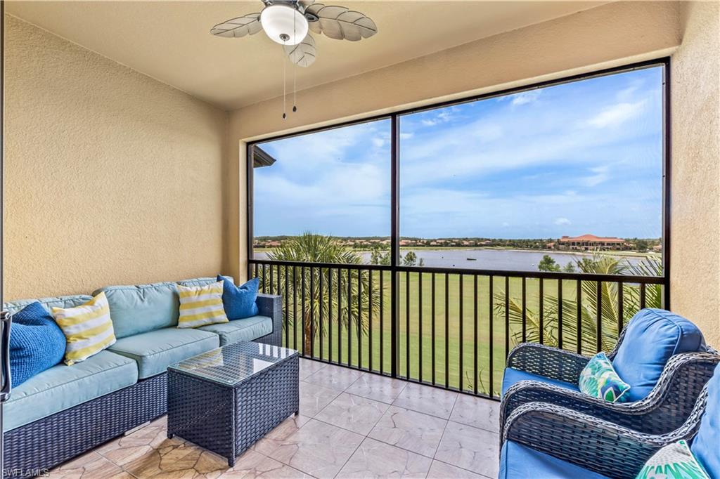 a balcony with furniture and a potted plant