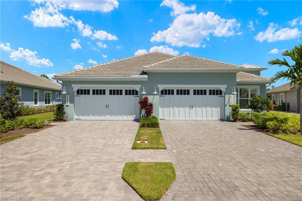 View of front facade featuring a garage