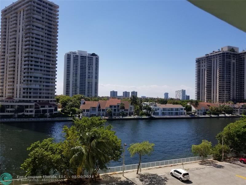 a view of a lake with tall buildings