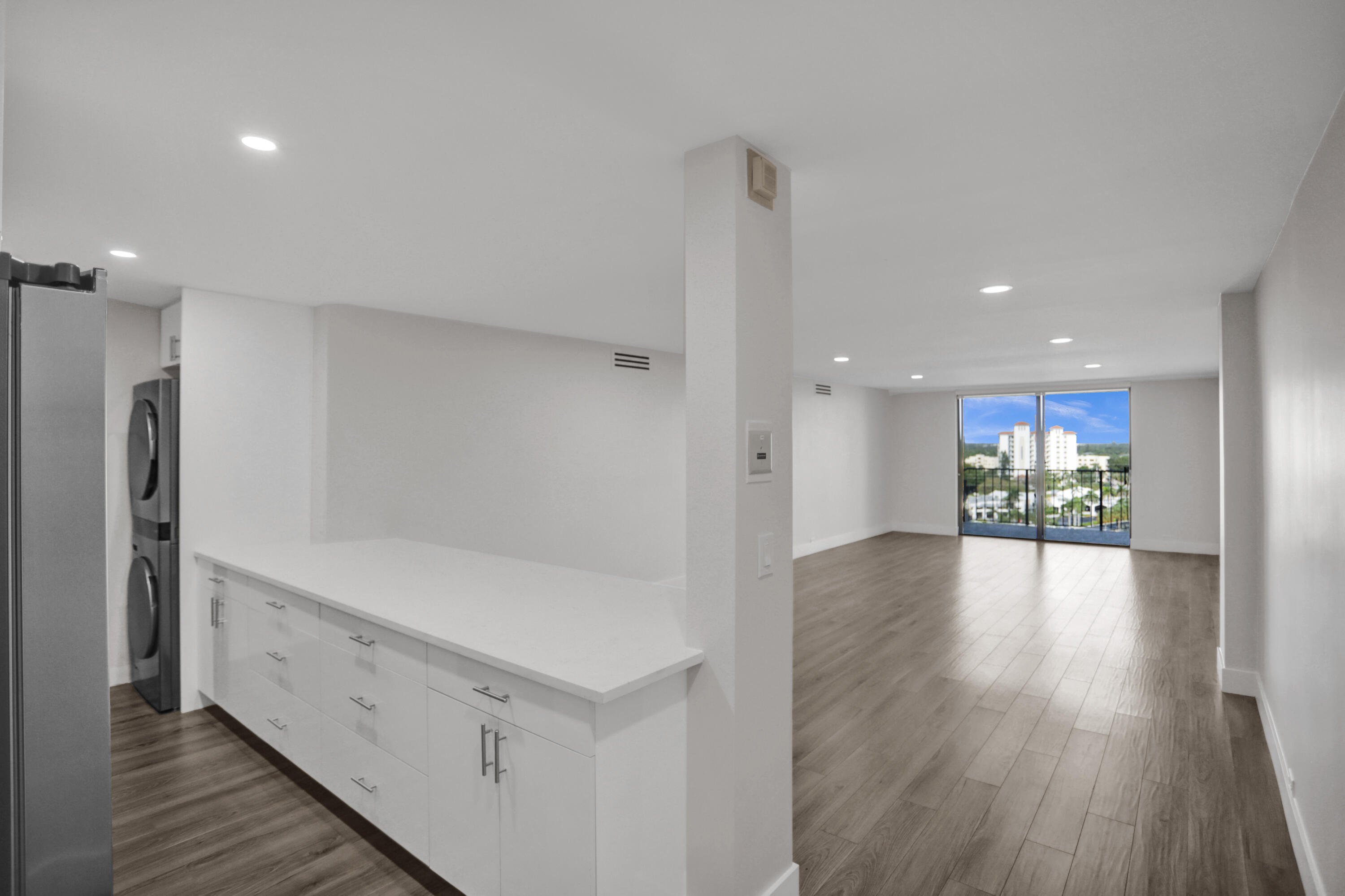 a view of kitchen with furniture and wooden floor