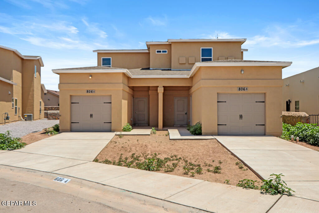 a front view of a house with a garage