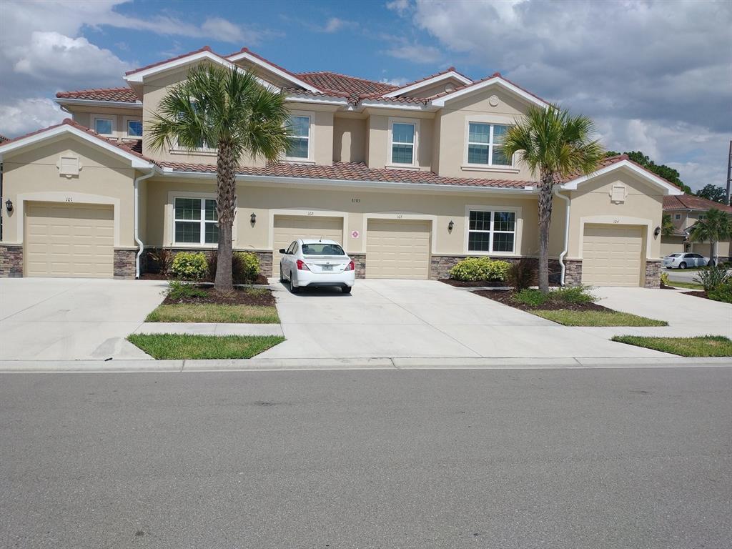 a view of multiple houses with a street