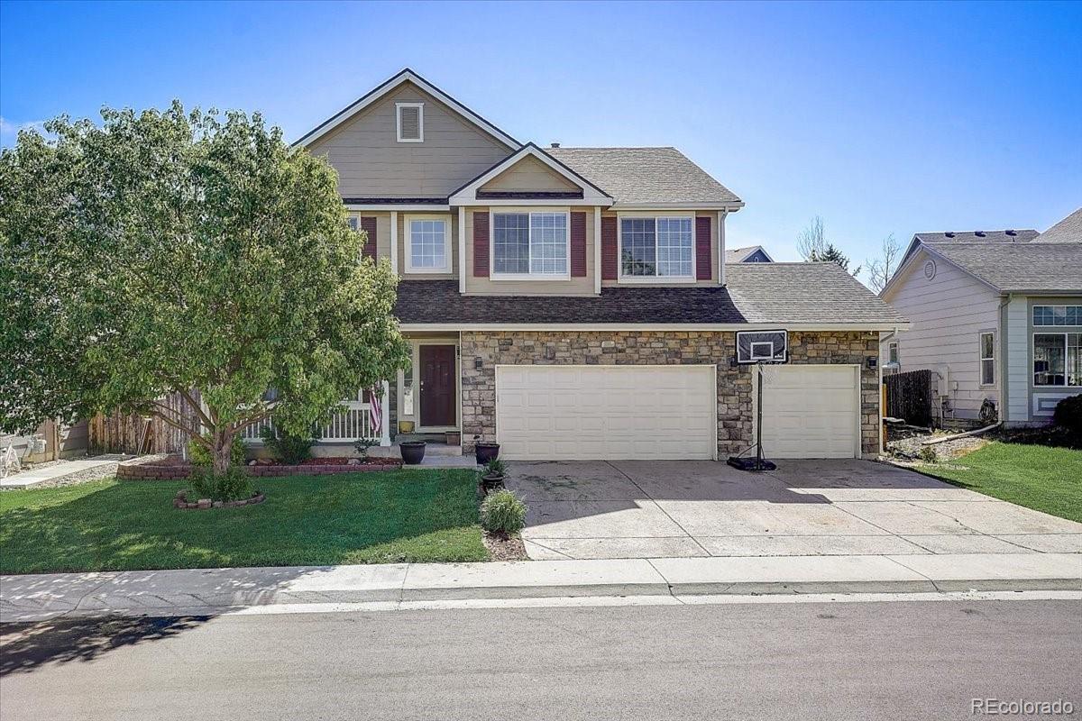 front view of a house with a yard