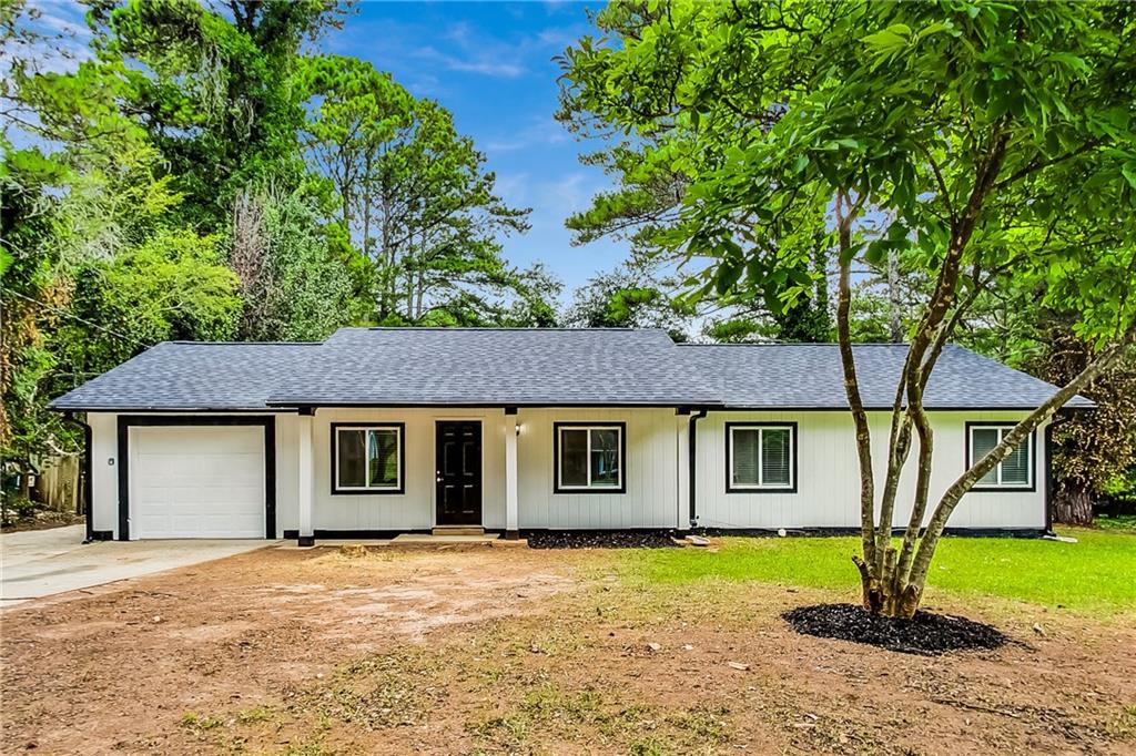 a house with a tree in front of it