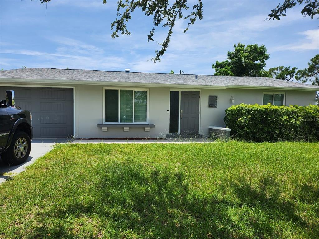 front view of a house with a yard