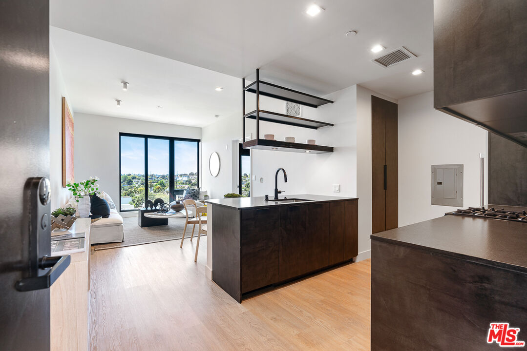 a living room with furniture and flat screen tv