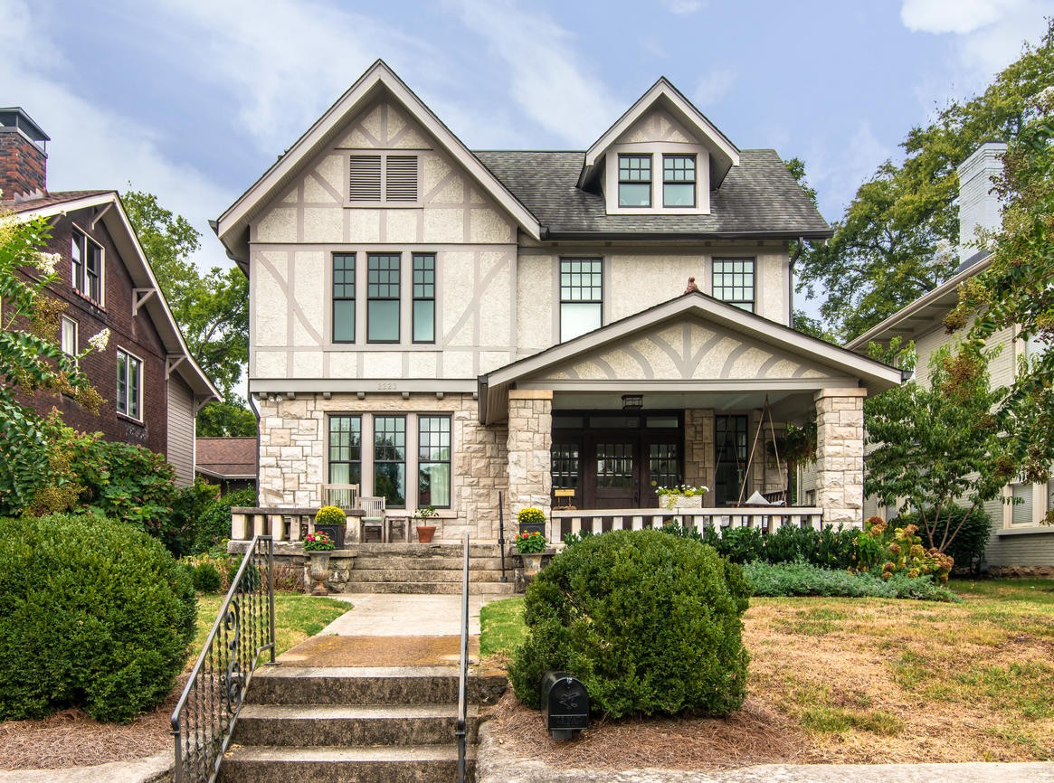 a front view of a house with garden